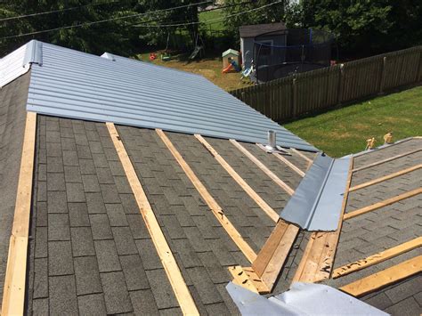 metal roof is installed to on aframe house|metal roof reviews and complaints.